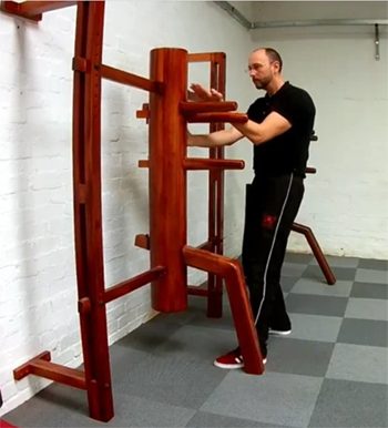 Sifu Alan Bagley training on the Wing Chun wooden dummy (Muk Yan Jong)